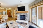 Bright living room area, with cozy fireplace